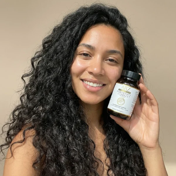 a woman who has results with hair growth with a hair supplement for hair growth